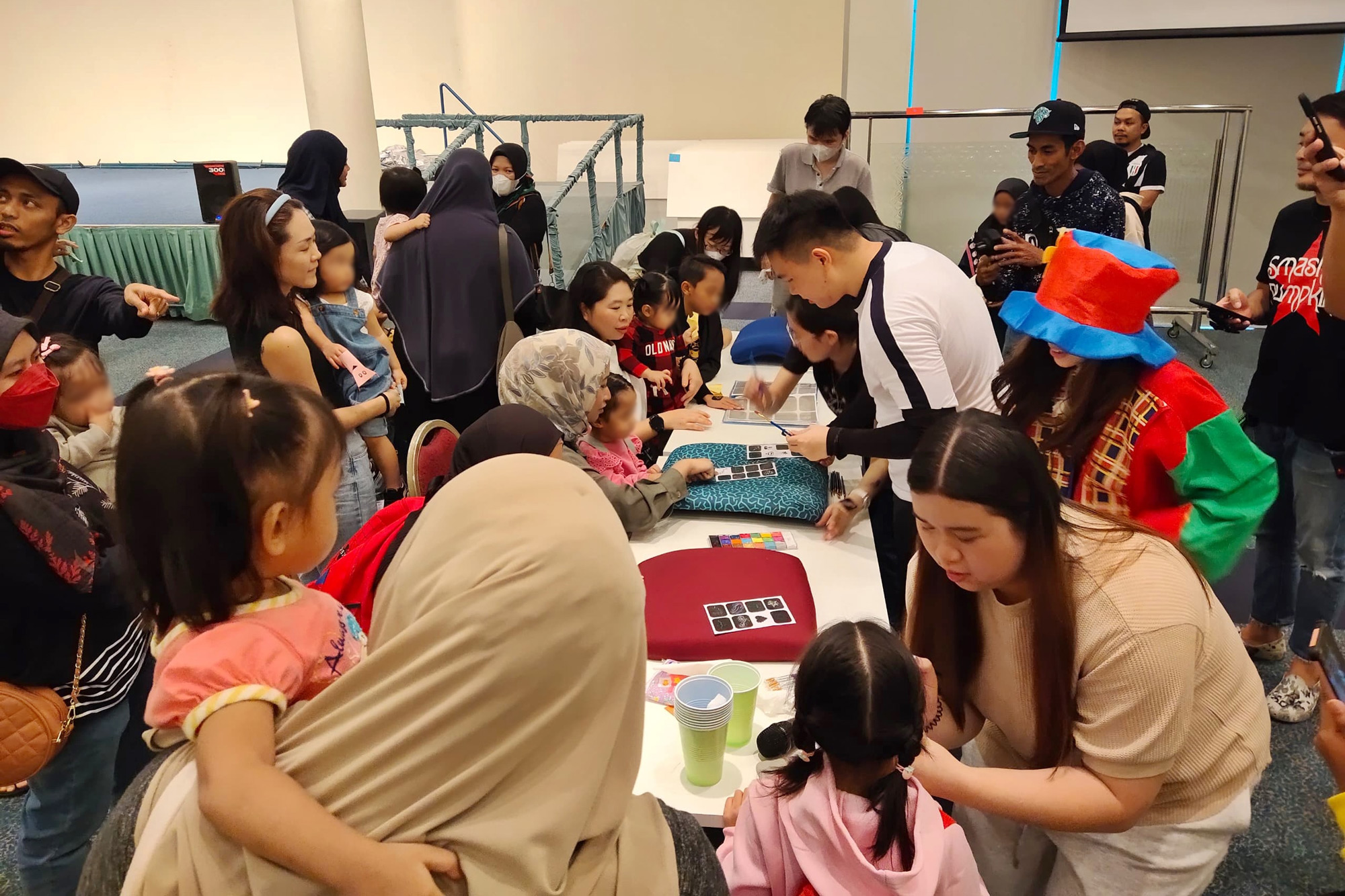 The families line up for face-painting. 