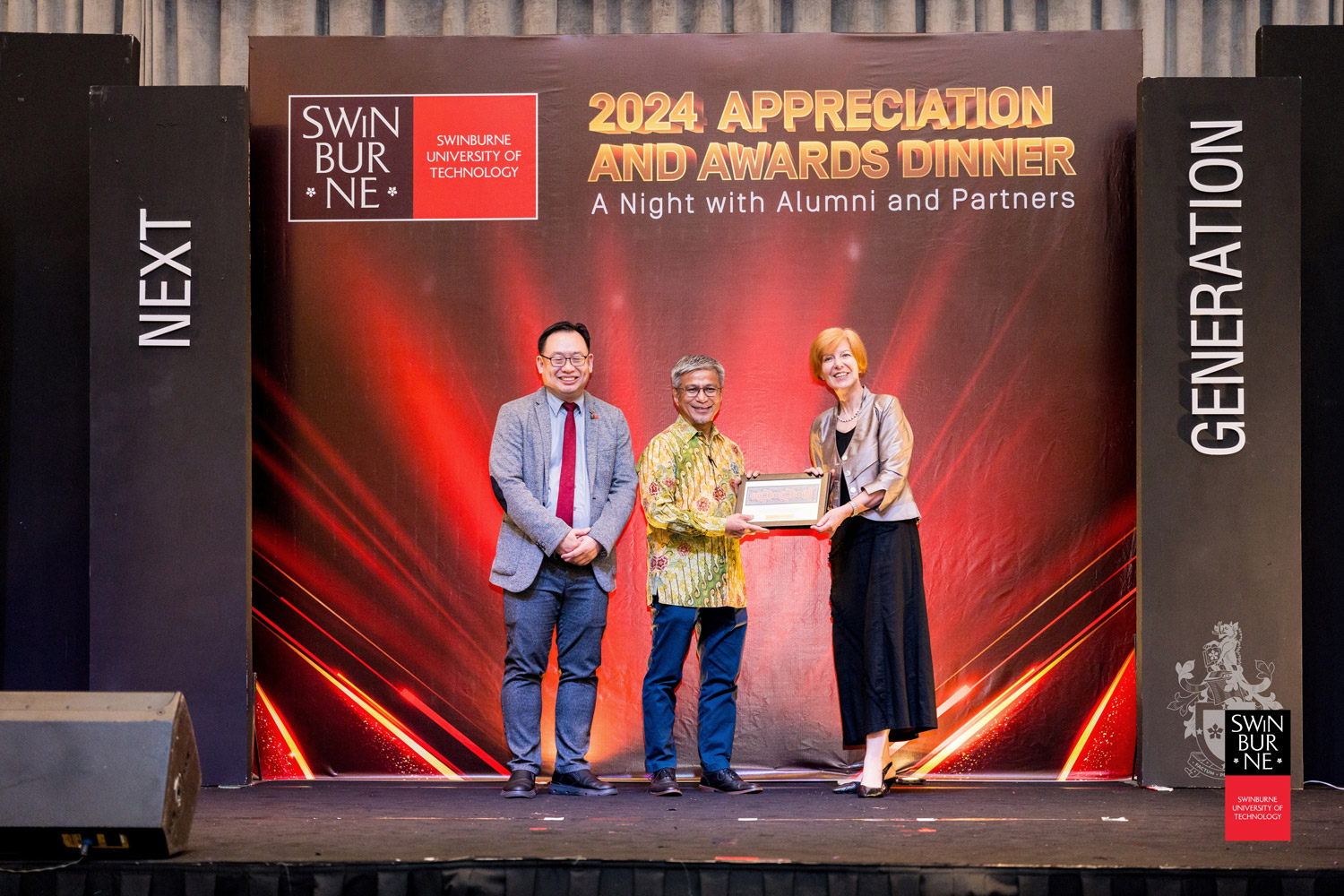 Professor Pascale Quester (right) presents a token of appreciation to YB Datuk Dr Annuar bin Rapaee as Ir Professor Lau Hieng Ho (left) looks on.