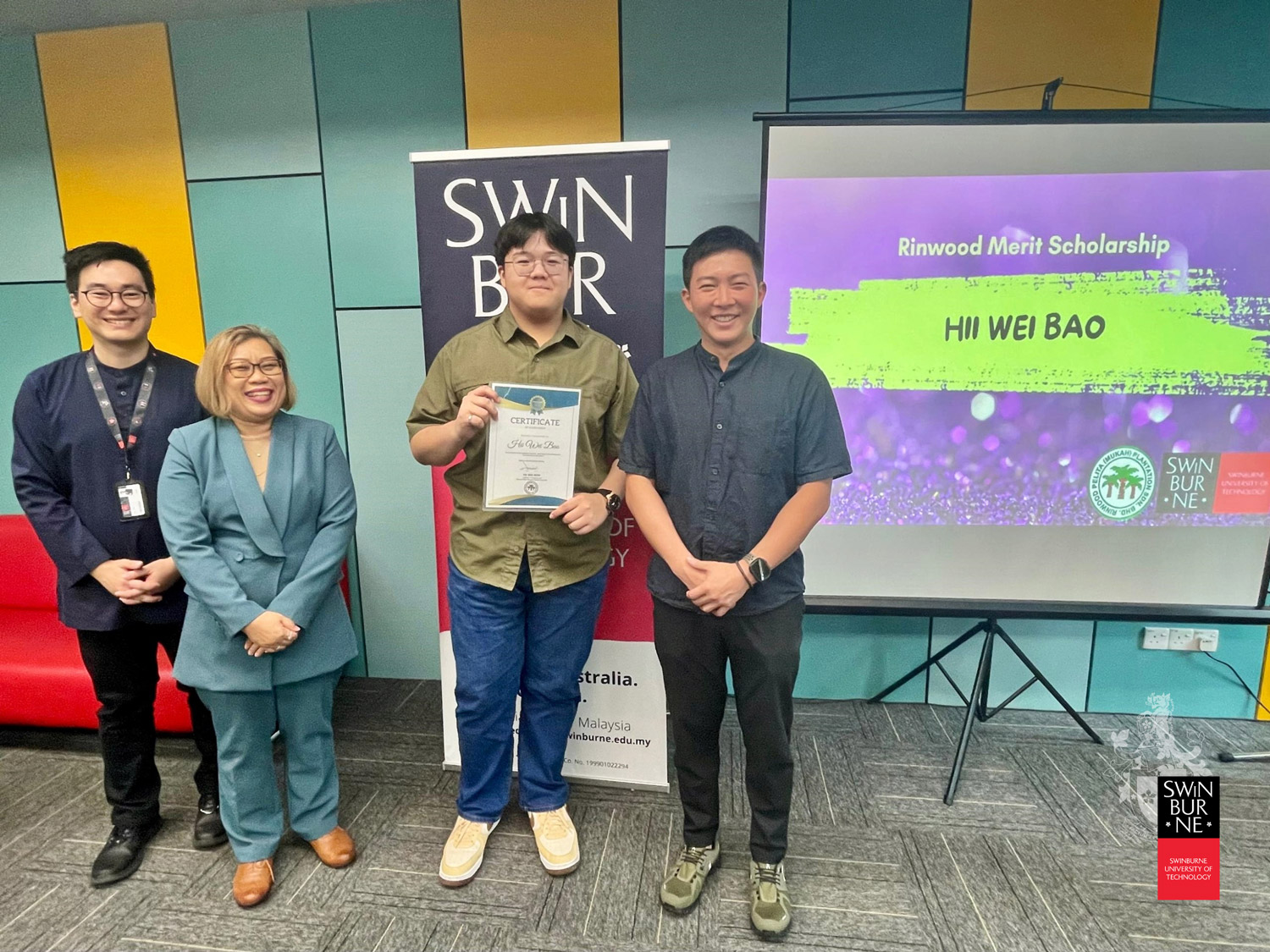 Hii Wei Bao (second right) receives his Rinwood scholarship. Also seen are (from left) Mr Chan, Ms Esty and Mr Hii.