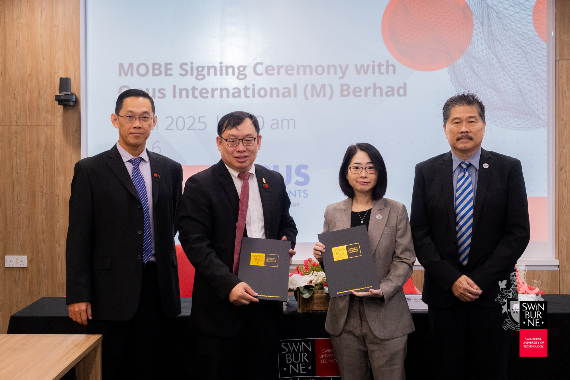 Ir Professor Lau Hieng Ho (centre left) and Ms Hillary Chua (centre right) with the signed MOBE. 