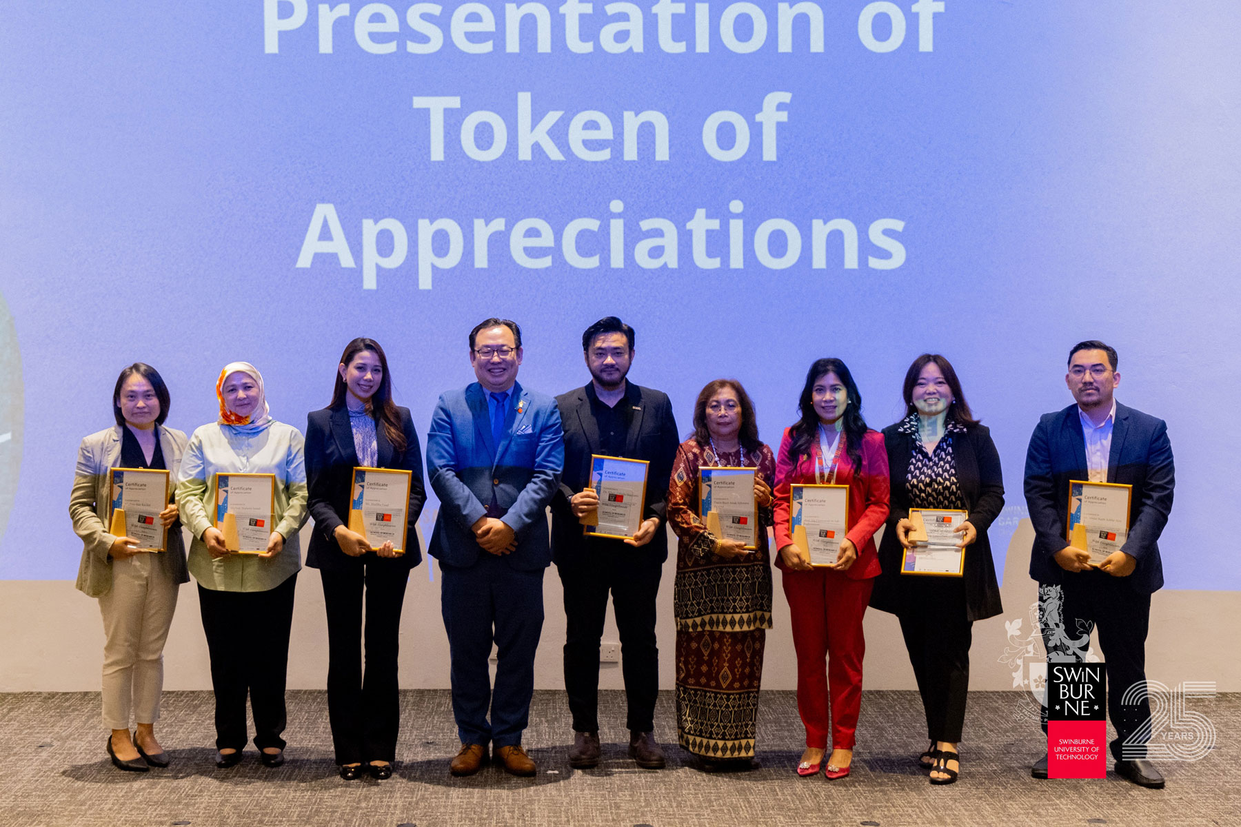 Tokens of appreciation are presented to speakers and panellists.